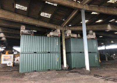 Damaged uprights that required emergency repair, shored up by containers and other steelwork